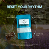 Fizzy bath product packaging with text 'Reset Your Rhythm' and nature-themed background